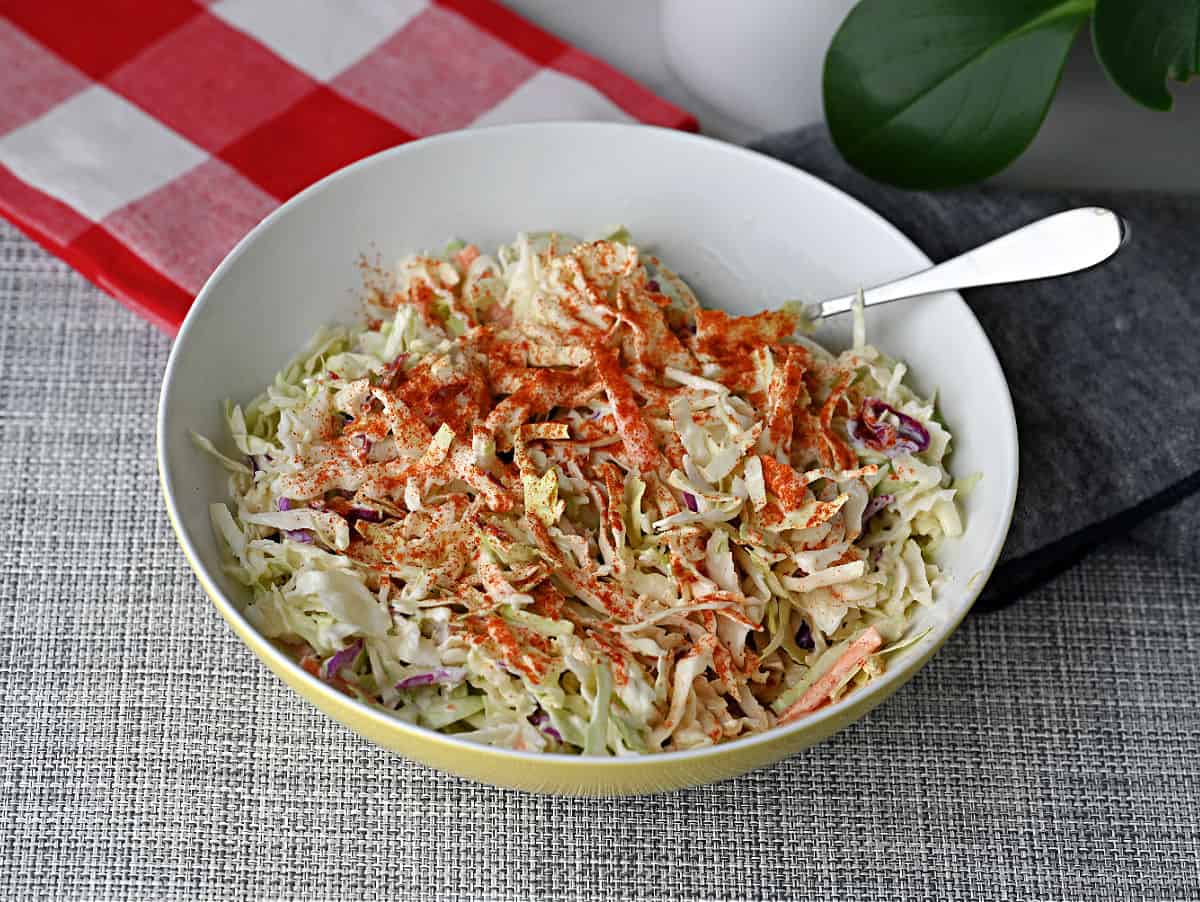 a bowl of coleslaw ready to serve.